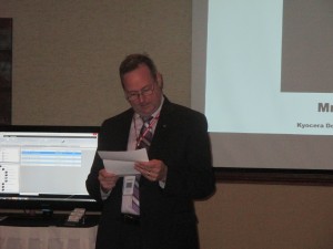 Tom Walsh, Vice President for Kyocera Western Division reads a letter from Mr.Ina, President of Kyocera America