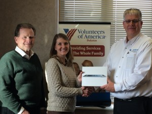 iPad Drawing winner Mallie Kludt pictured  center with  Volunteers of America CEO, Dennis Hoffman pictured left and Century Business Products Kevin Jergenson presenting the gift on the right.